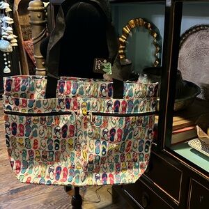 NWT nylon Travel bagfrom Hawaii. 14” tall 18” wide 5” deep W/ 3 zippers